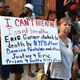 People gather outside the funeral service for Eric Garner at Bethel Baptist Church in Brooklyn on July 23, 2014.
TIMOTHY A. CLARY/AFP/Getty Images